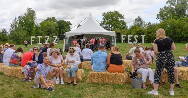 Alresford Ukulele Jam entertaining the crowd at Hampshire Vineyards Sparkling Wine Festival or Fizz Fest